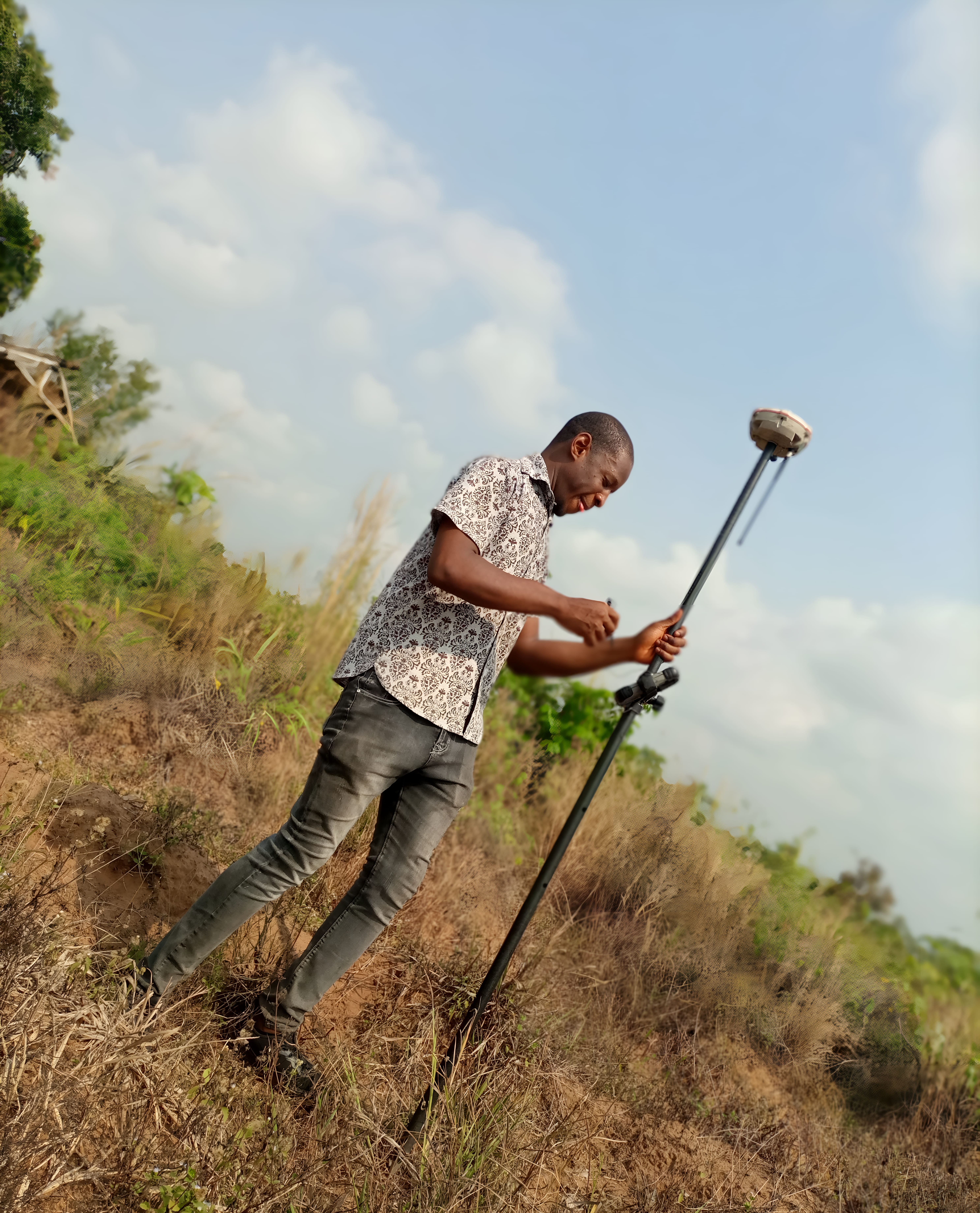 Field surveyor picking boundary points